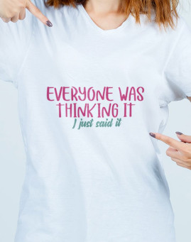 young lady pointing herself in t shirt, jeans and looking proud. front view.